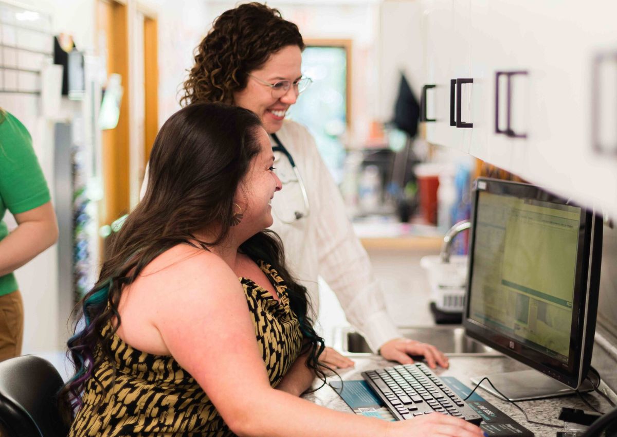 two person seeing a computer screen